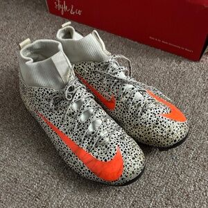 Nike Black and White Speckled Cleats with Orange Swoosh